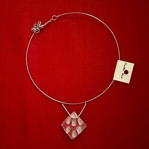 Wire choke with handmade glass pendant.